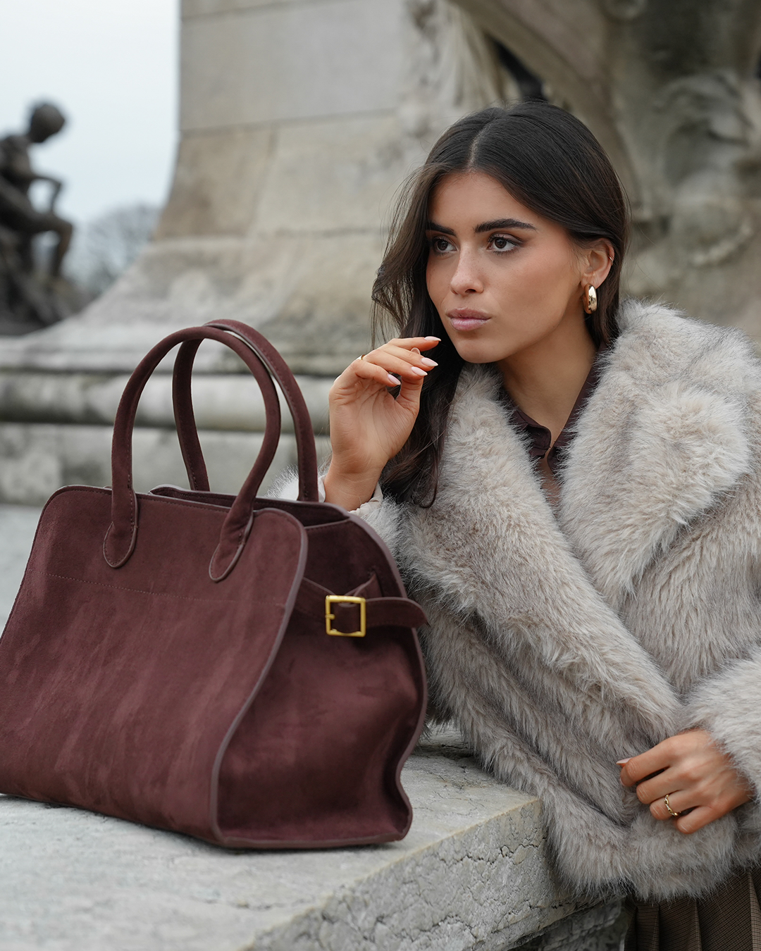 SOERA brand campaign with a white outfit and burgundy bag.